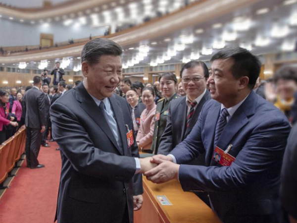 2019年3月4日在北京人民大会堂，中共中央总书记、国家主席、中央军委主席习近平和周善红亲切握手。